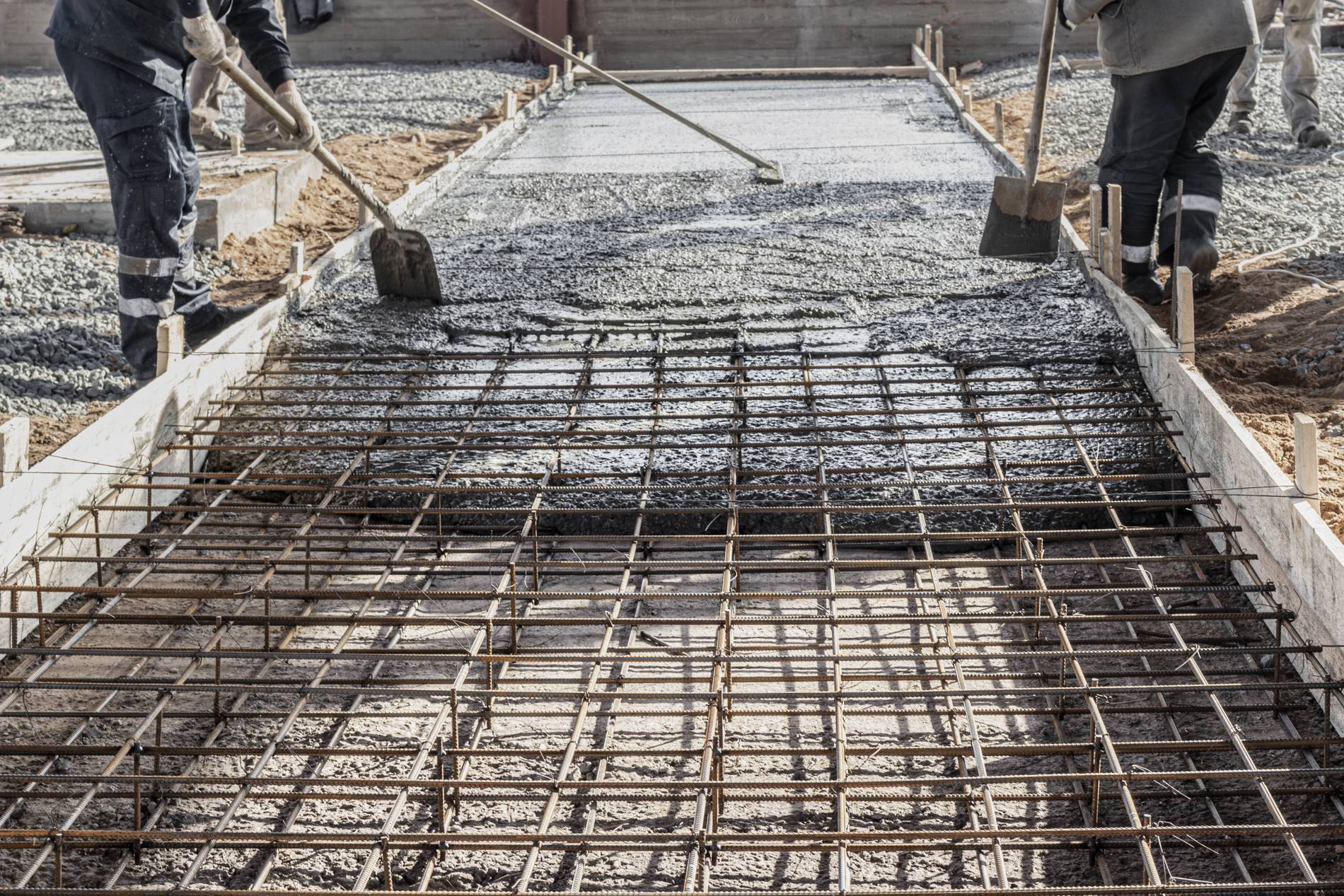 pouring-cement-concrete-with-concrete-mixer-truck-construction-site-with-reinforced-grillage-foundation-start-construction-production-workshop_1900x1267